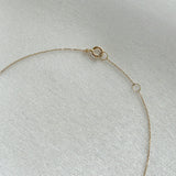 Detail view of 14K gold chain links and clasp on Petite Diamond Cross Necklace
