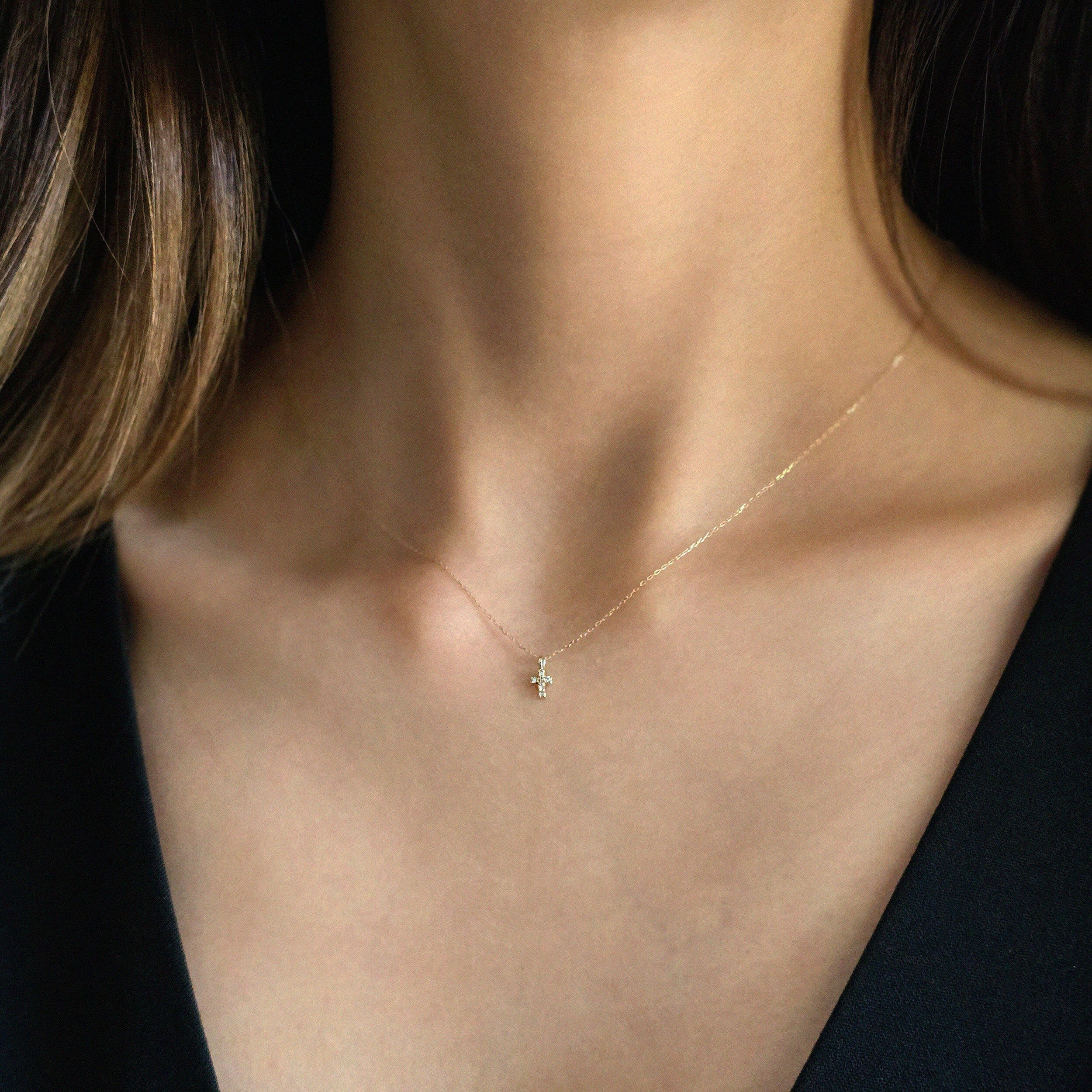 Detail view of 14K gold chain links and clasp on Petite Diamond Cross Necklace