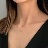 Detail view of 14K gold chain links and clasp on Petite Diamond Cross Necklace