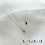 14K Petite Diamond Cross Necklace with clear or green stone, dainty cross pendant photographed