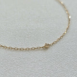 Close-up of the 1.5mm diamond and 14K gold chain links on the Petite Diamond Bracelet