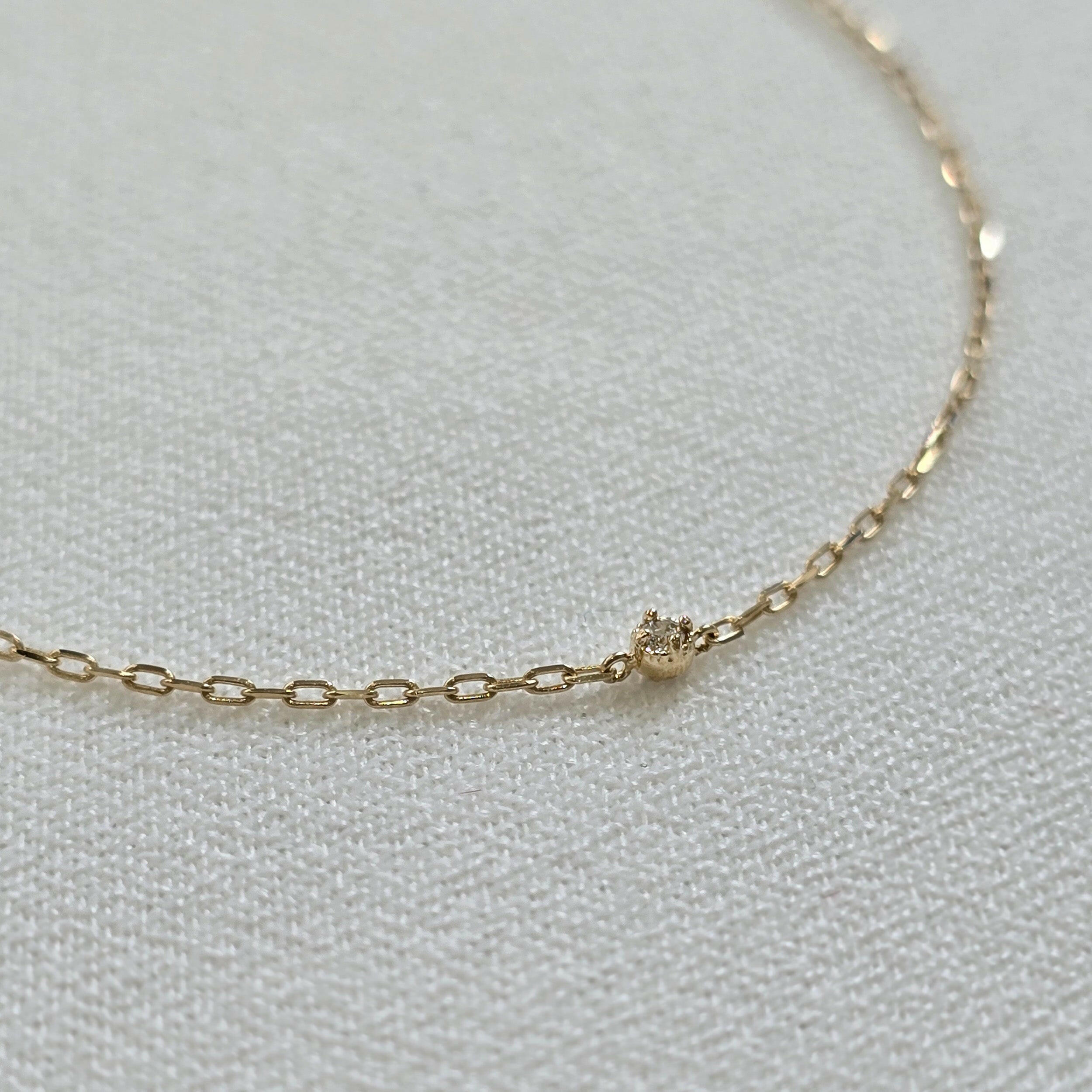 Close-up of the 1.5mm diamond and 14K gold chain links on the Petite Diamond Bracelet