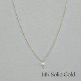 Front-facing image of full necklace laid out in U-shape to show complete chain and pendant placement
