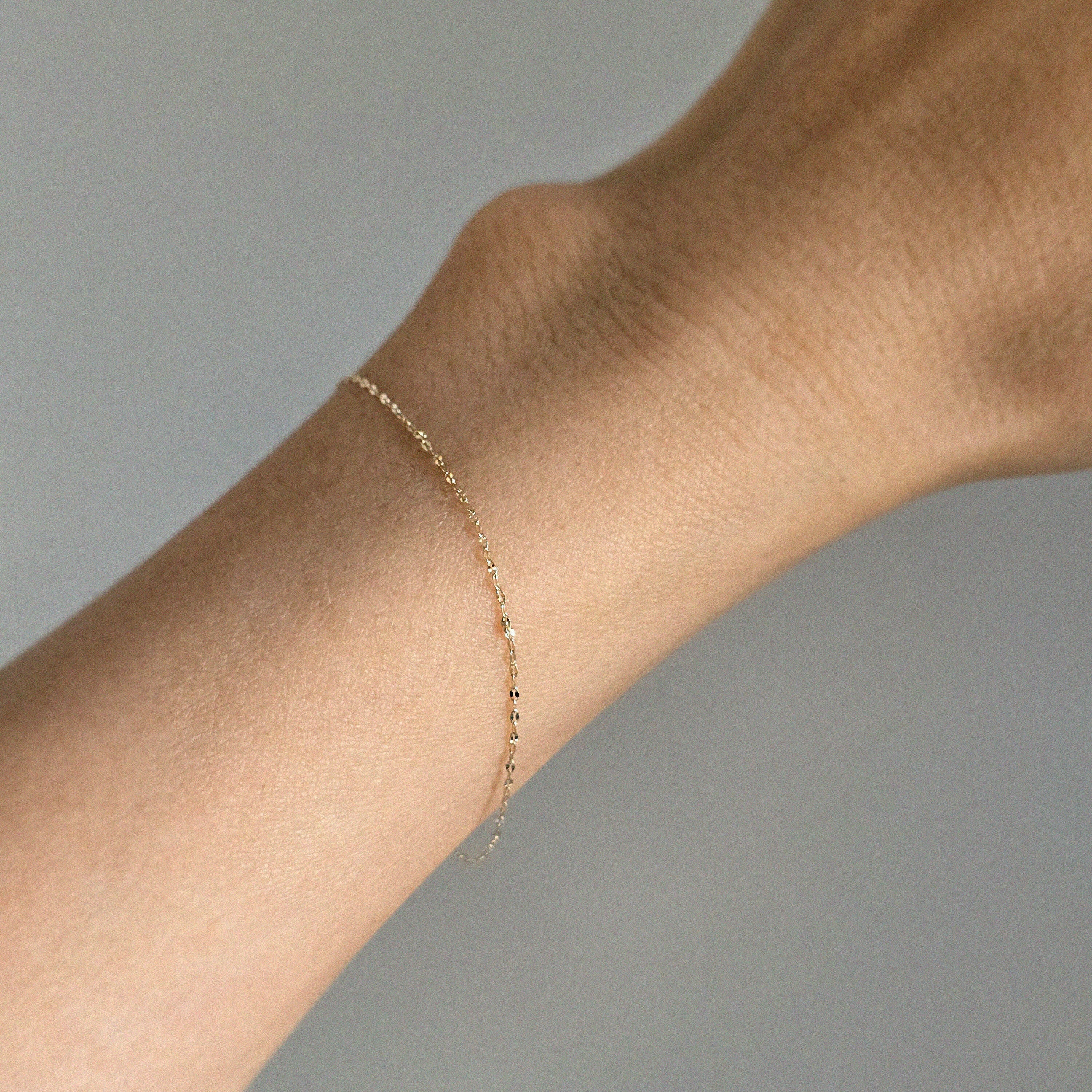 Model wearing the Roma Bracelet solo for a refined, minimalist look