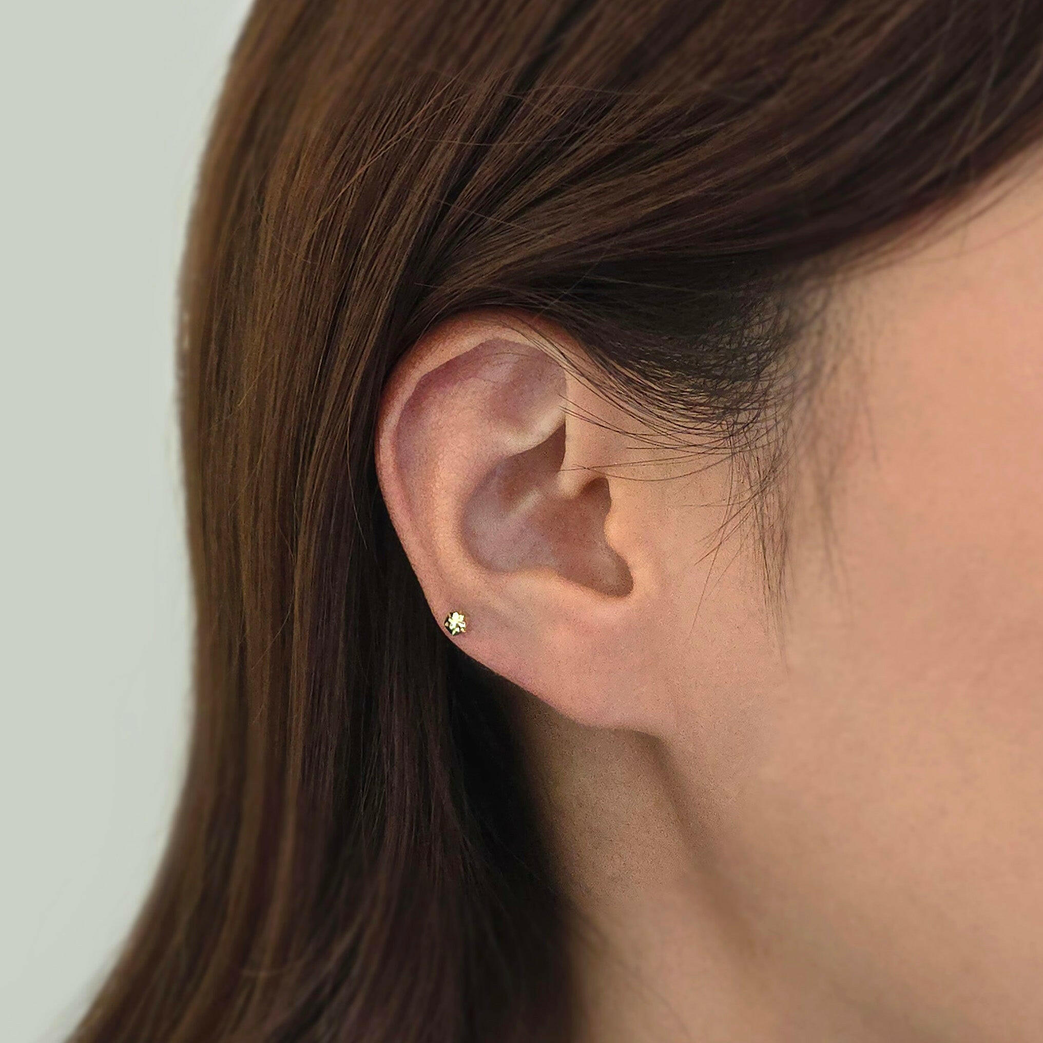 Model wearing Shiny Hexagon Cartilage Earring on earlobe