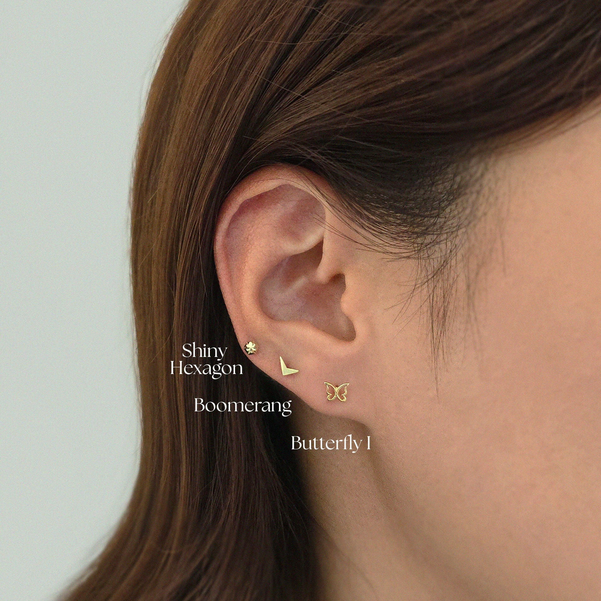 Boomerang cartilage earring layered with Laondrim cartilage earring for bold styling