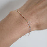 Dainty gold bracelet with square accents styled for everyday wear