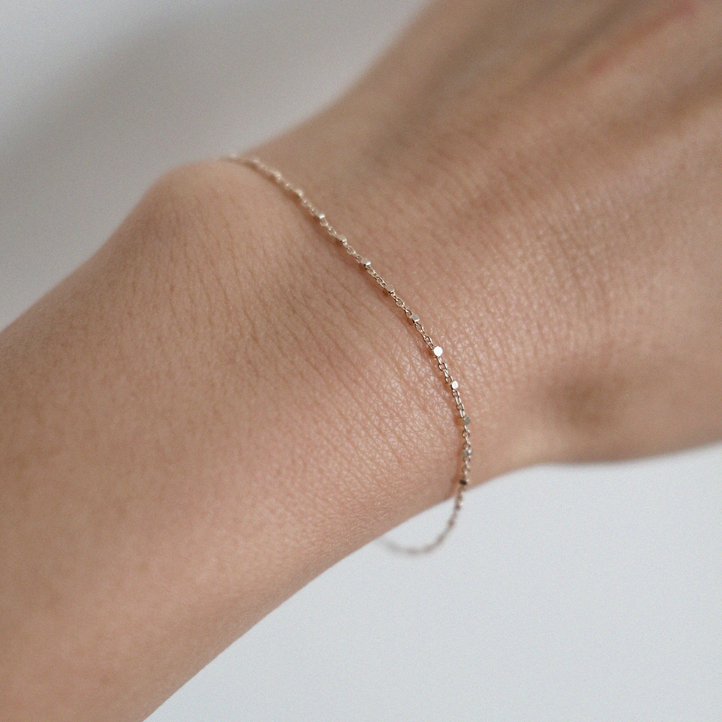 Dainty gold bracelet with square accents styled for everyday wear
