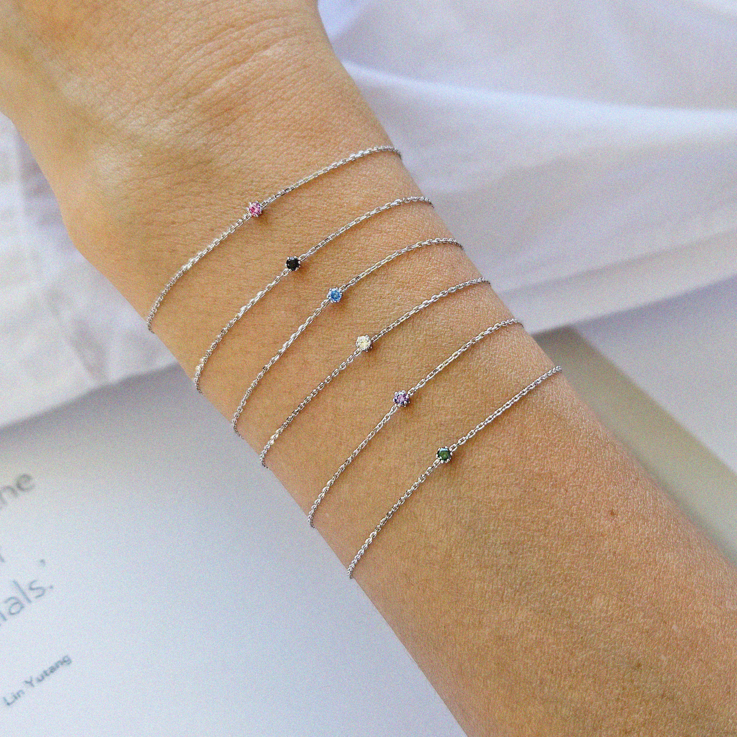 Petite crystal bracelet featuring a delicate stone and fine chain, perfect for elegant jewelry collections.