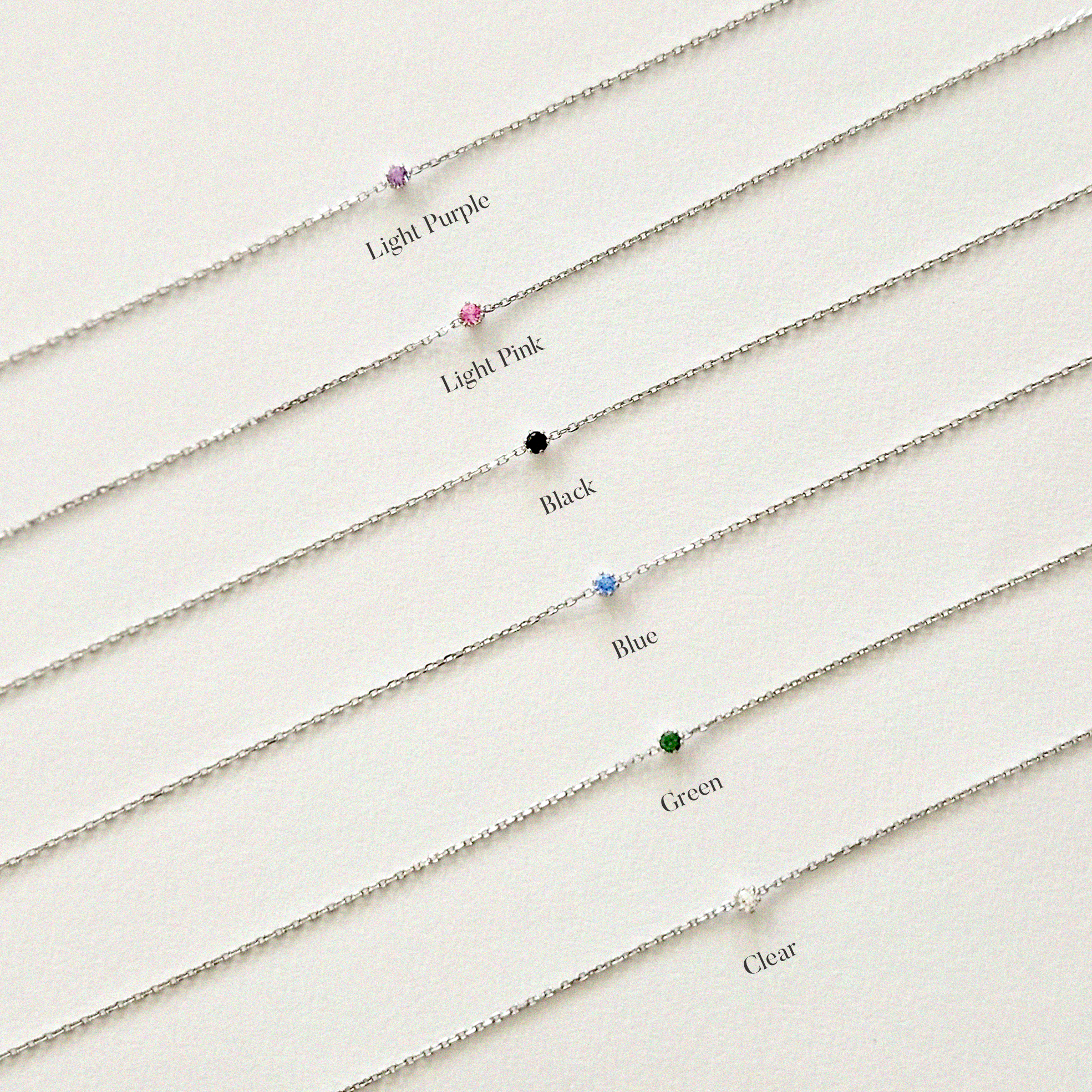 Petite crystal bracelet featuring a delicate stone and fine chain, perfect for elegant jewelry collections.