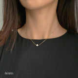Single pearl necklace exemplifying elegant minimalism, perfect for timeless and sophisticated style.