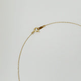 Spring ring clasp of 14K necklace with high-polish finish and secure O-ring closure