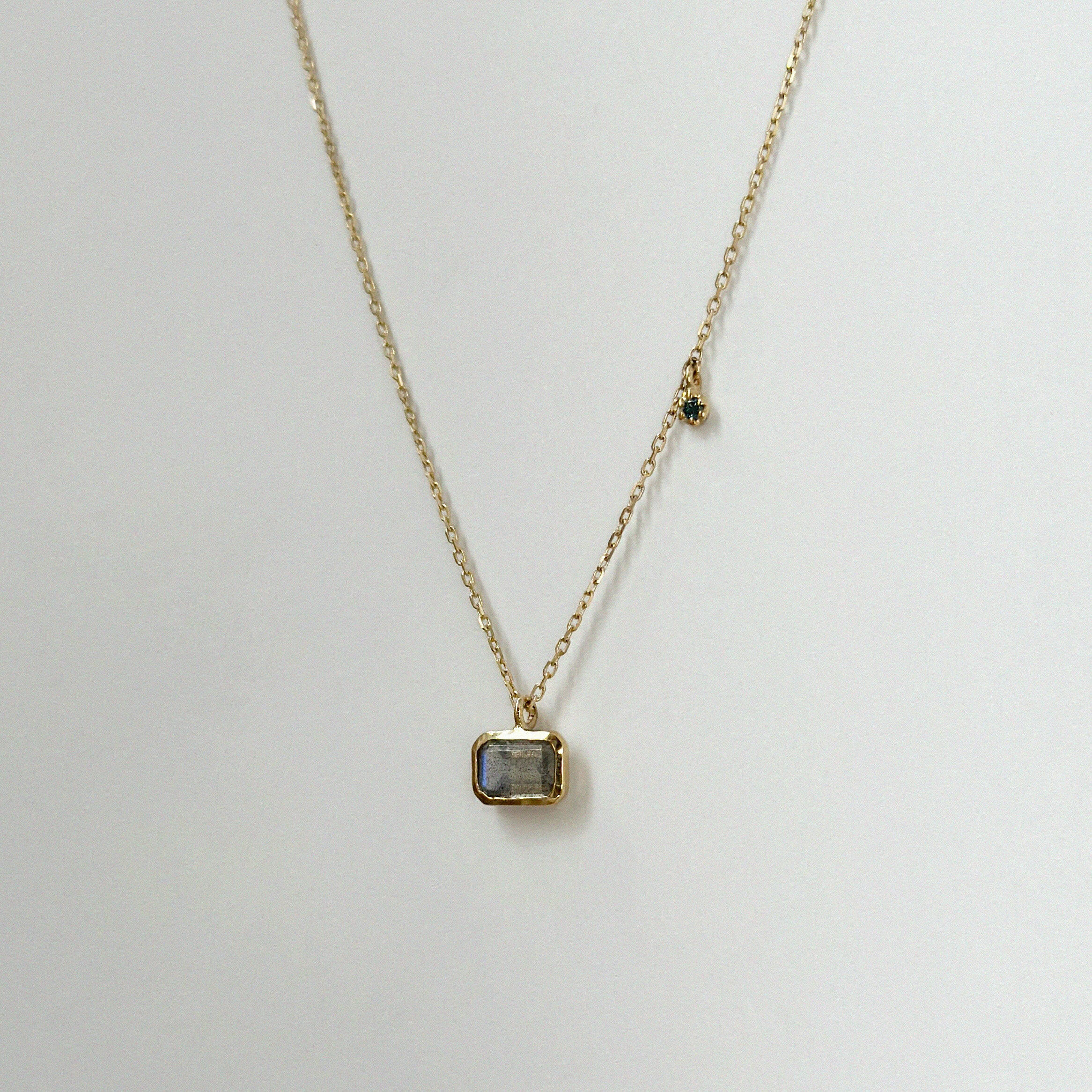 14K Aurora Labradorite Necklace close-up showing the labradorite’s iridescent sheen and green diamond accent in bezel setting