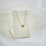 Stella Mia Necklace displayed on white ㅣleather necklace stand – celestial charm highlighted