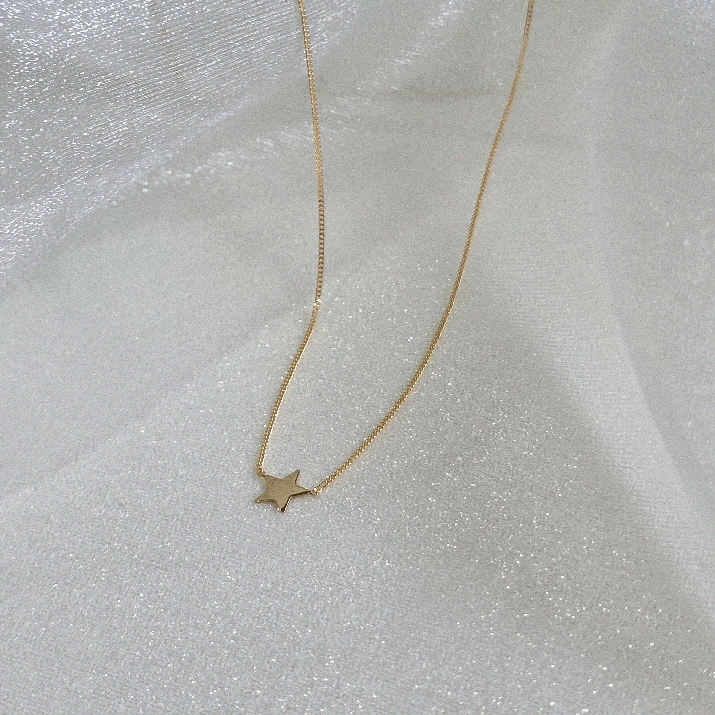Side perspective of pendant catching light from different angles