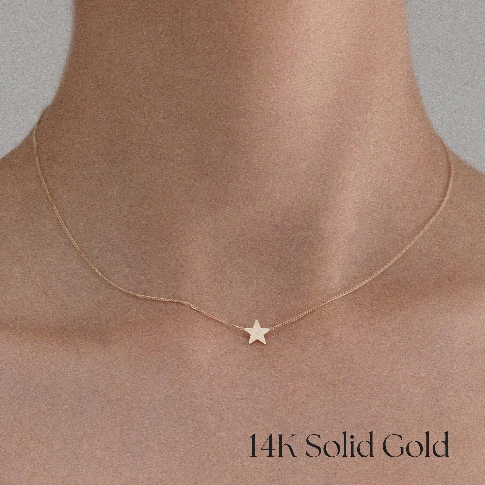 Model wearing Stella Mia Star Necklace styled with white blouse – celestial elegance