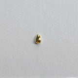 Symmetrical teardrop cartilage stud captured from front angle