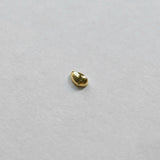 Polished teardrop-shaped cartilage stud on clean white background