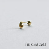 Side-angle view of 14K gold teardrop cartilage earring on clean white background