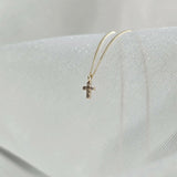 Side profile showing pendant thickness and light reflection of diamond cross