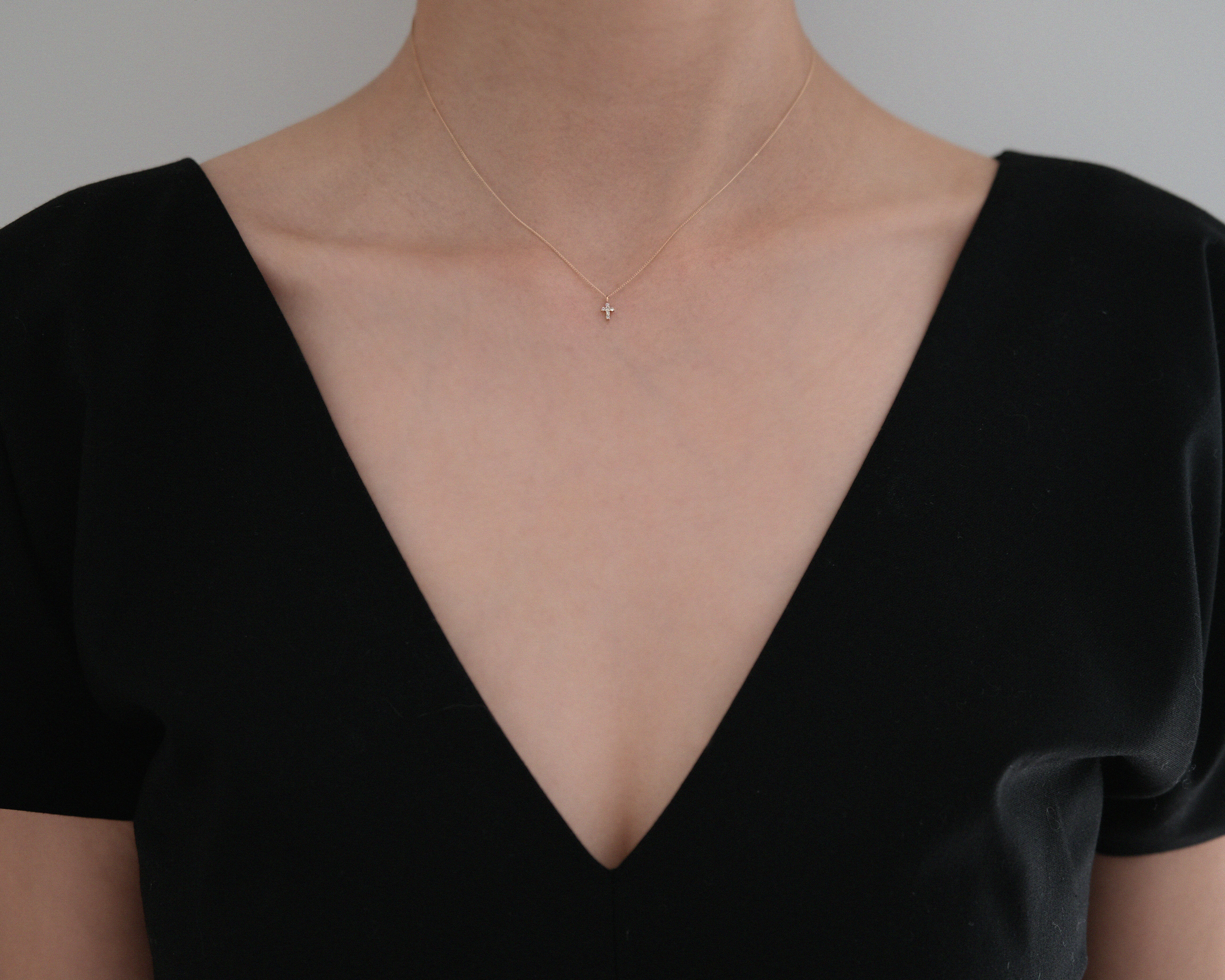 Styled shot showing faith-inspired necklace worn solo for daily elegance
