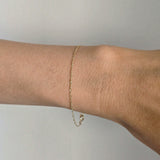 Close-up of the 14K Torino Bracelet on wrist, catching light with every movement