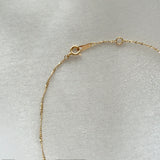 Close-up showing the secure clasp mechanism of the 14K gold Torino chain