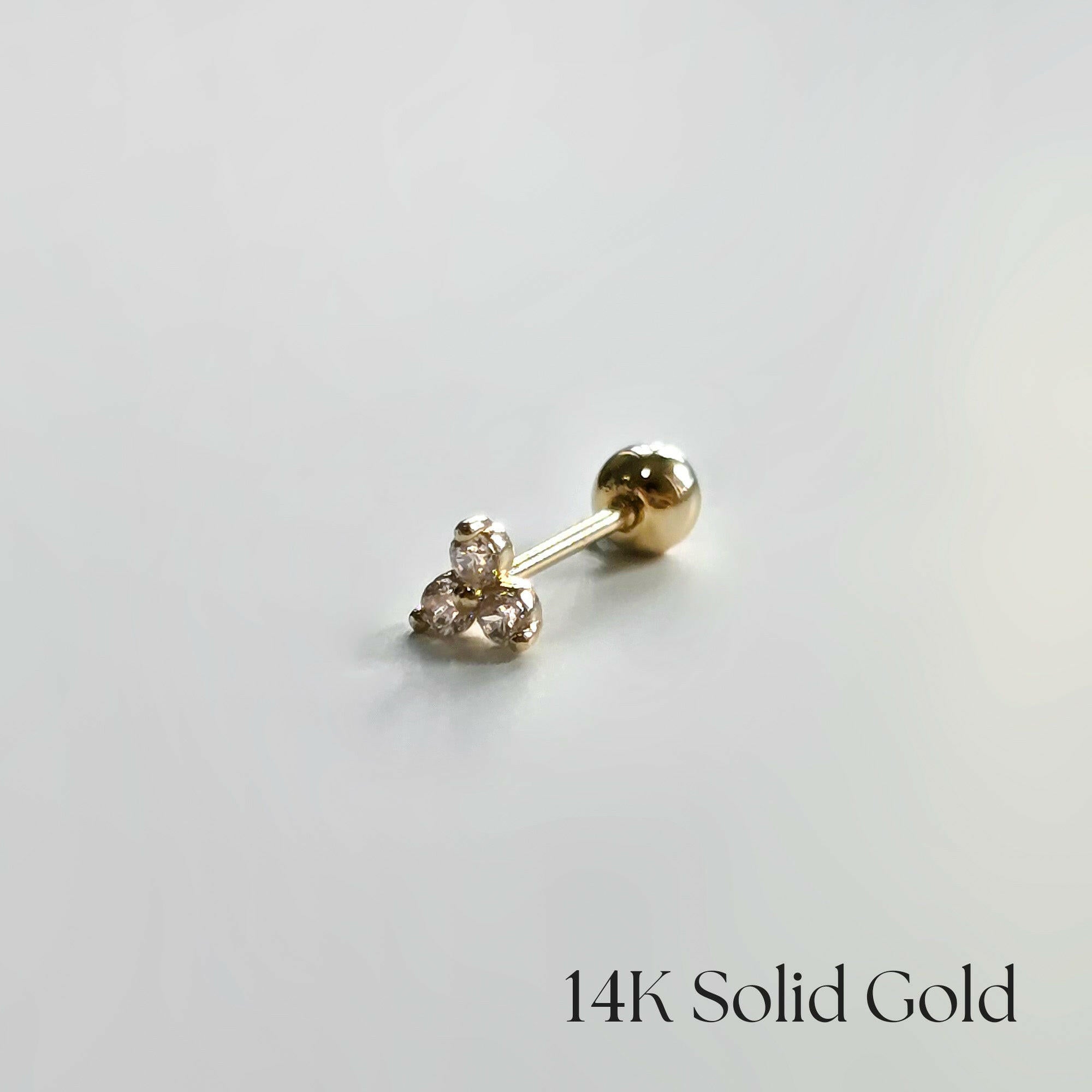 Side view of the 14K gold Trio Crystal Cartilage Earring, showing subtle sparkle