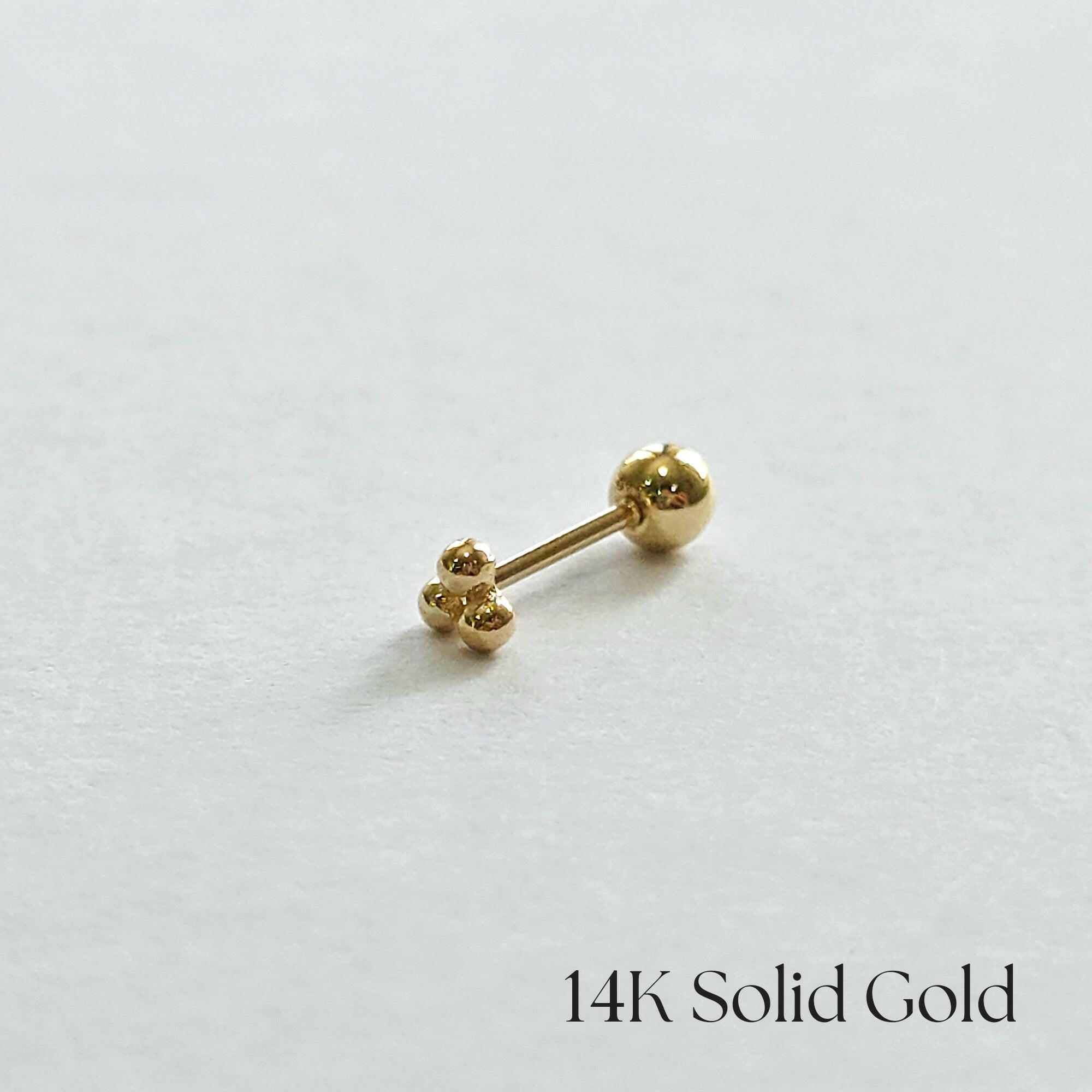 Three-ball cluster cartilage stud earring side profile photo