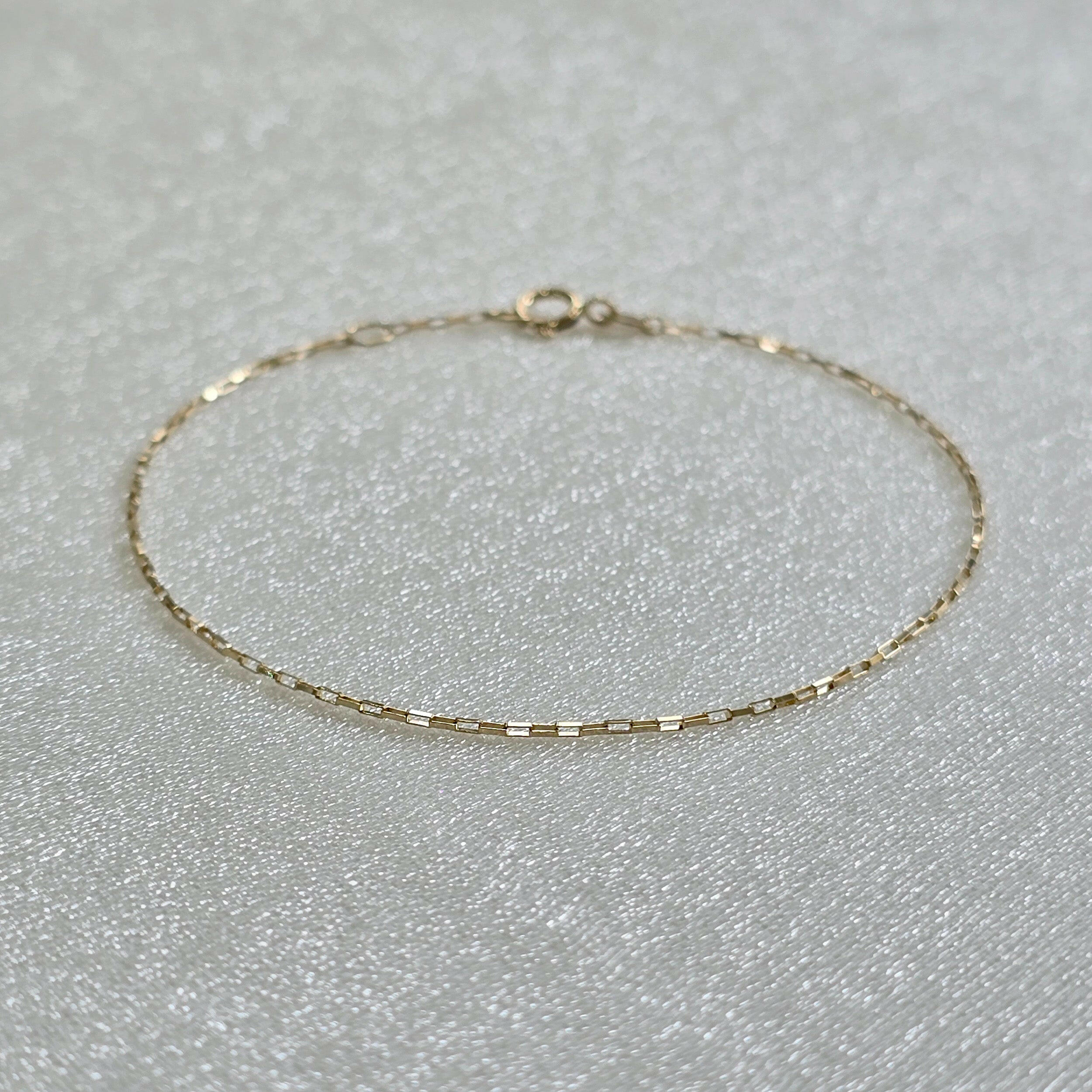 Macro view highlighting the delicate paperclip chain detail