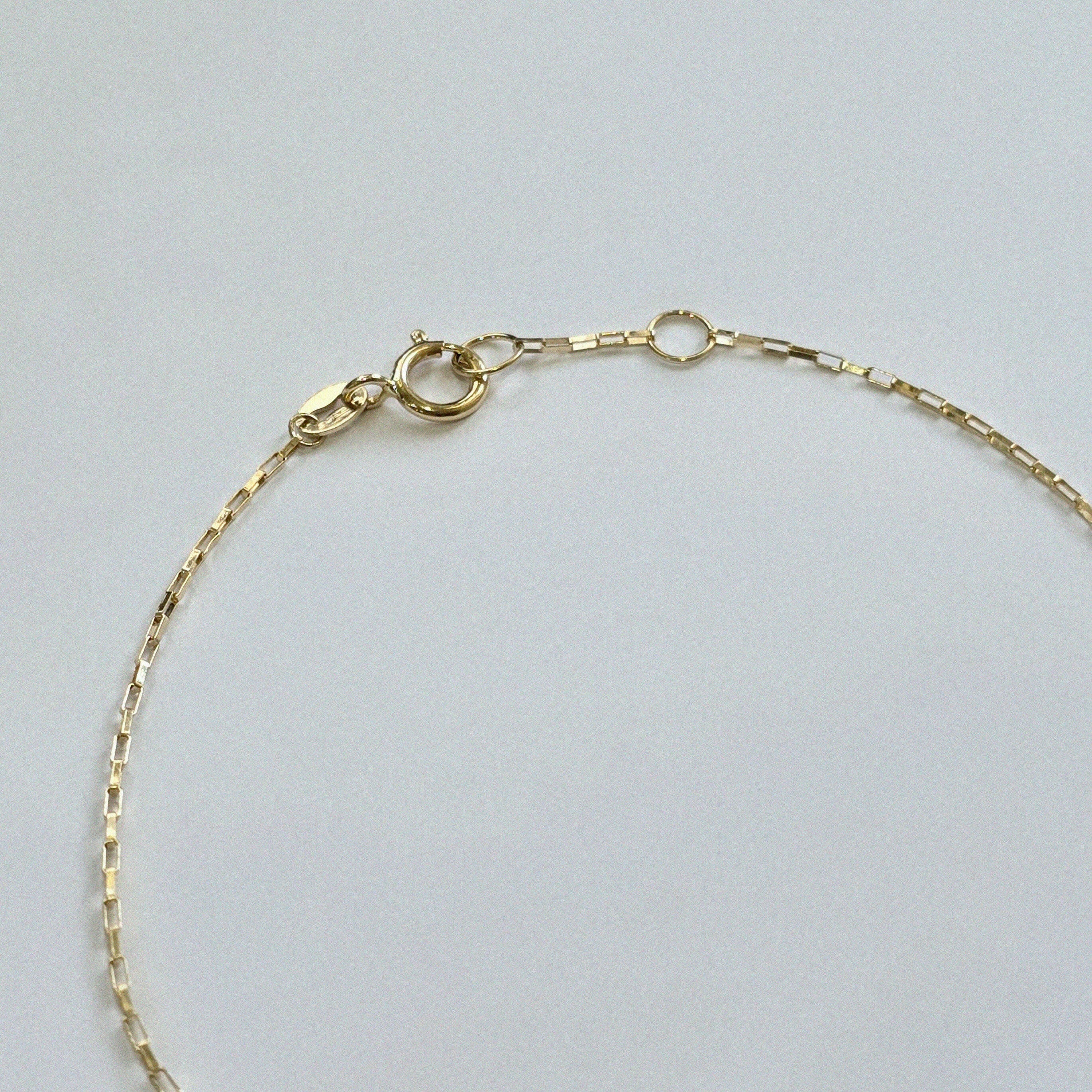 Close-up of Venezia Bracelet’s fine link structure and 14K gold clasp