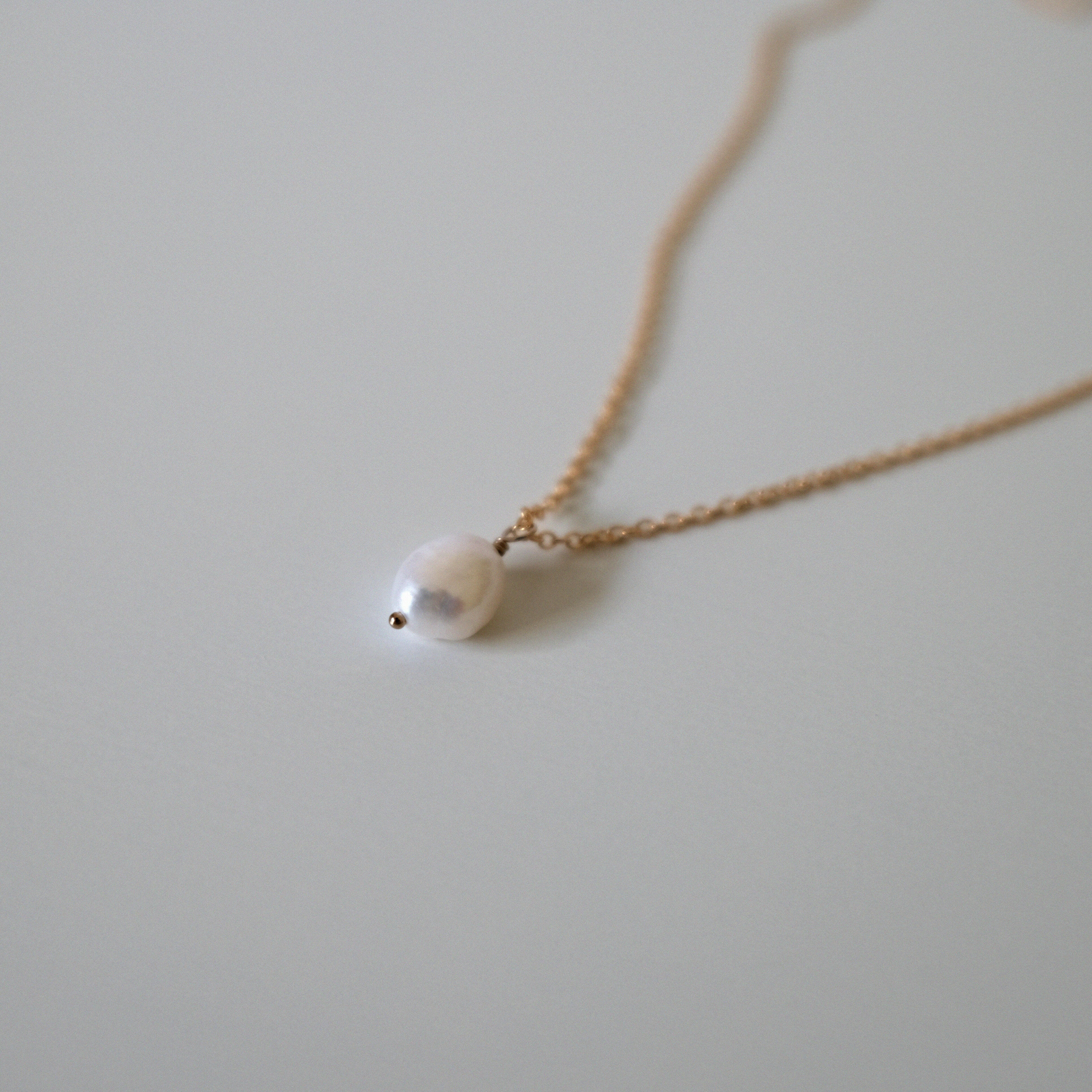 Close-up of 9mm freshwater pearl on fine gold filled chain
