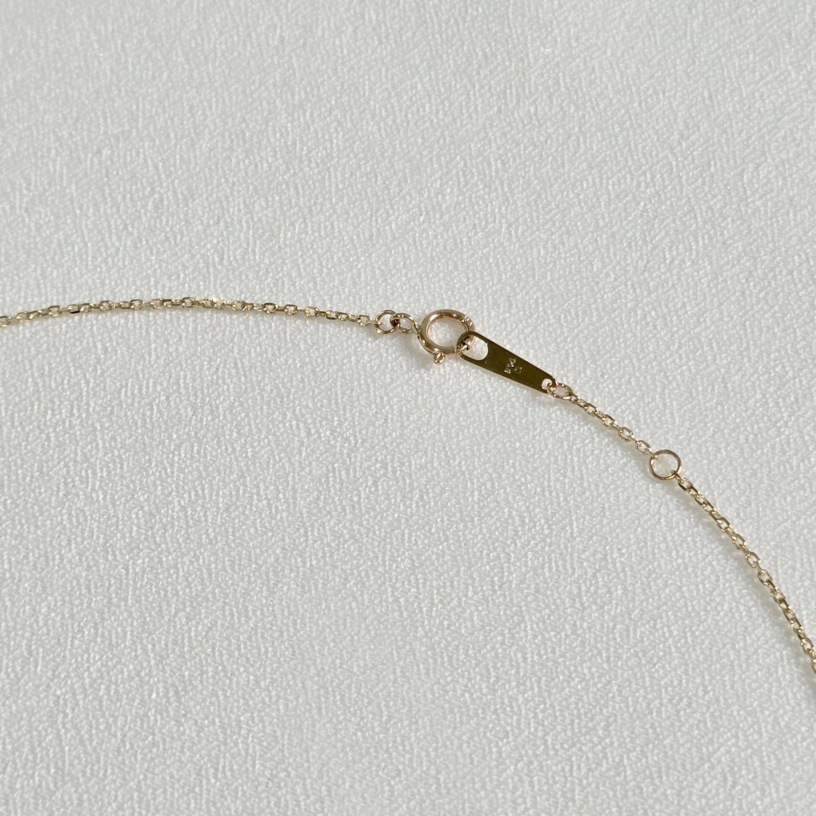Spring ring clasp and extender detail in polished 14K gold – secure and elegant finish