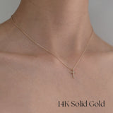 Model wearing Diamond Croce necklace – cross pendant sits at collarbone