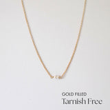 Double pearl gold filled necklace laid flat with symmetrical spacing