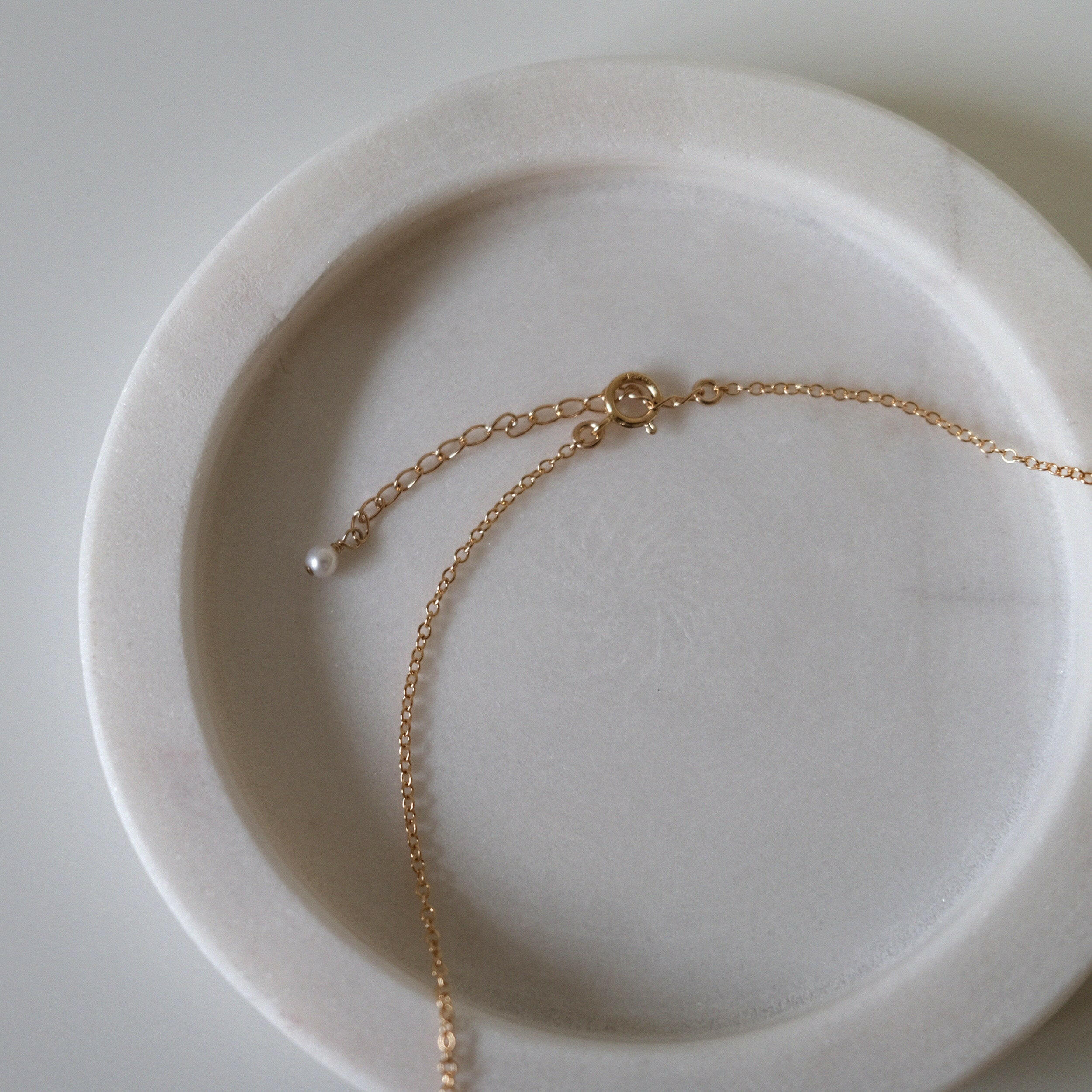 Close-up of spring ring clasp and extension chain detail