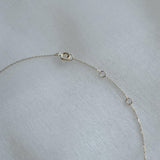 Detailed view of the spring ring clasp and connecting oval ring of the Circle with Diamond Necklace