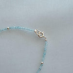 Close-up of 14K gold clasp and bead detail on the Gemma Bracelet