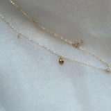 14K Solid Gold Love Is Key Necklace – Heart lock and key charm with CZ detail on adjustable chain, tarnish-free and perfect for romantic occasions