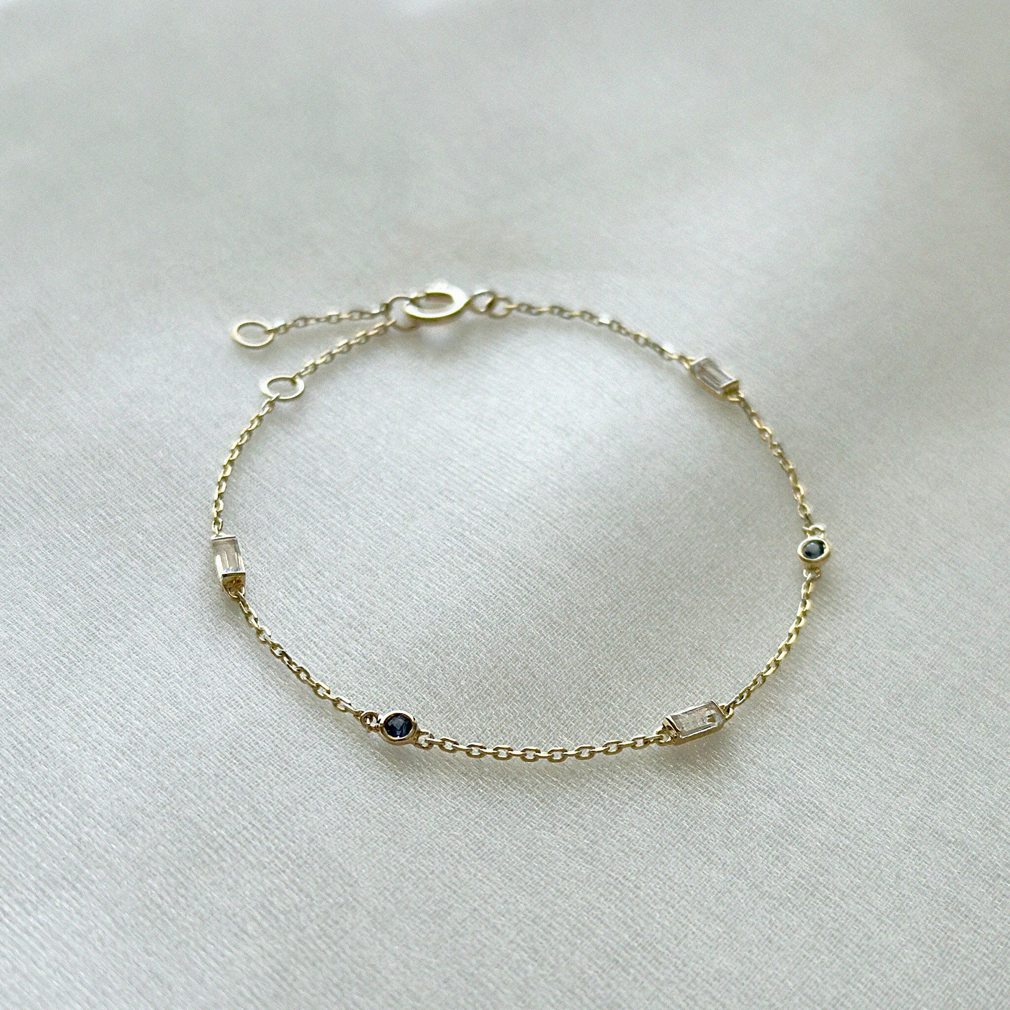 14K Rhea Stone Bracelet featuring Rainbow Moonstone and Blue Sapphire on a white background