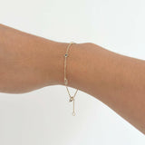 Model wearing the Rhea Stone Bracelet with Rainbow Moonstone and Blue Sapphire