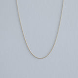 14K gold Tiffany chain displayed in full against a soft background for an elegant, lightweight impression
