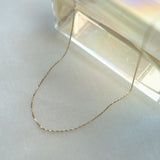 Side angle of the Twist Box Chain Necklace highlighting the dimension and depth of the twisted links