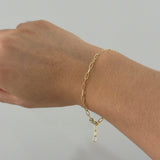 Bracelet worn on wrist viewed from above, showing link details and subtle shine