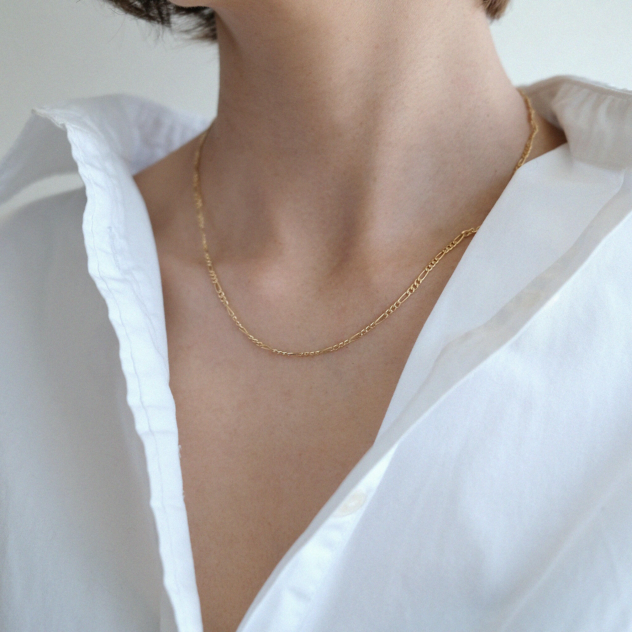 Model wearing Figaro chain necklace solo