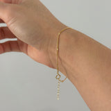Side angle showing bracelet clasp and extended chain draping naturally
