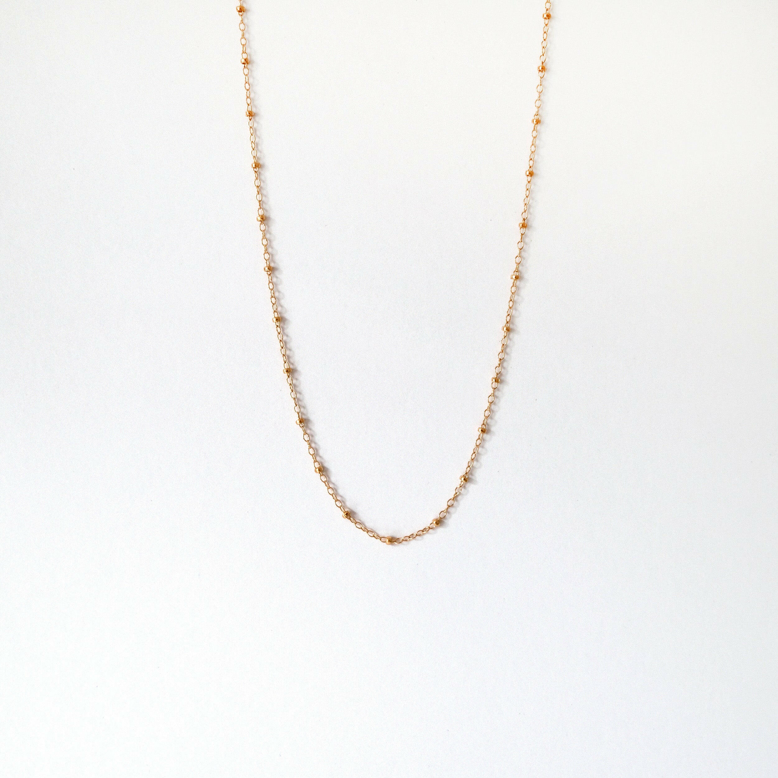Necklace displayed on neutral bust highlighting sparkle and structure
