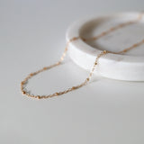 Close-up of gold filled chain showing dainty bead accents