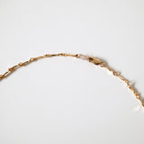 Close-up of polished gold links reflecting soft light