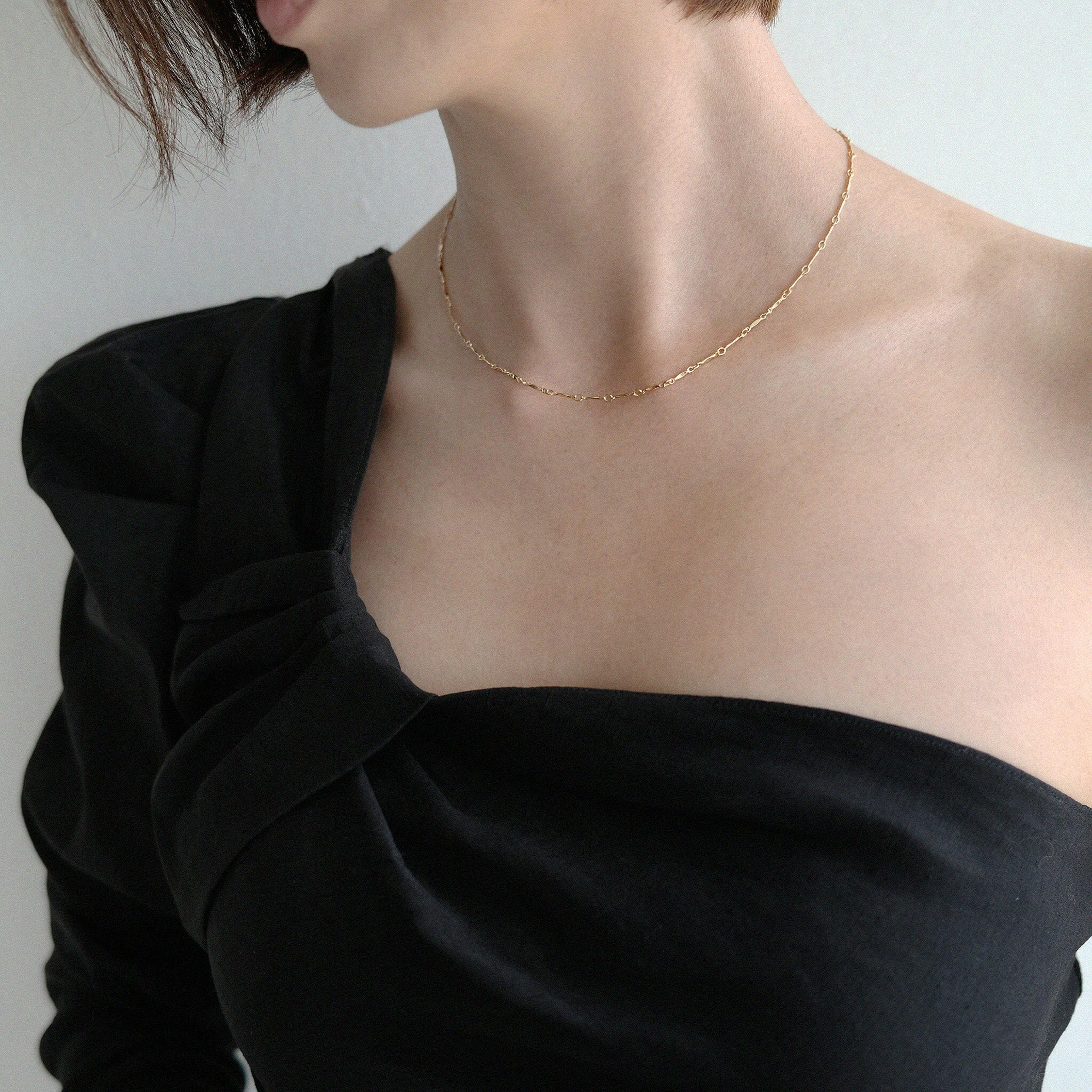 Model wearing Lydia necklace solo with a minimalist styling